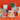 Decorative mugs and gift boxes with Christmas designs on a red background