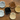 Top view of 6 different styles of dog-shaped ceramic dishes arranged in a circle.