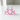 Pink balloon dog-shaped earrings on a white background