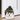 Plush dog-shaped door stop wearing a green plaid winter hat with faux fur trim.