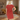 Woman wearing a red dress with white trim on a white background