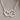 Silver necklace with a heart and paw print design on a white background