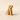 Wooden dog sculpture on a beige background