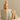Wooden cat and dog bookends on concrete plinths against a beige wall.
