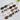 Collection of dog-shaped earrings on a light wooden surface