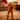 Dog fetching the Football Plush Dog Toy, showing its plush texture and football shape.
