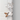 Dog-shaped sticky notepad hanging by its tail on a door for fun organization.
