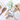 Dog toys, treats, and utensils on a white surface with wooden cutting board