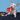 Dog pulling drumstick toy from plush bucket