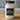 Close-up of candle label with handcrafted soy wax in rustic mason jar