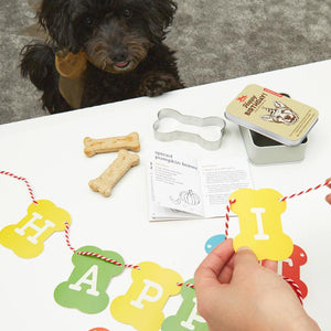 Dog Party Kit Featuring A Dog Treat Recipe Book Bone Shaped Cookie Cutter Banner Confetti And A Birthday Hat